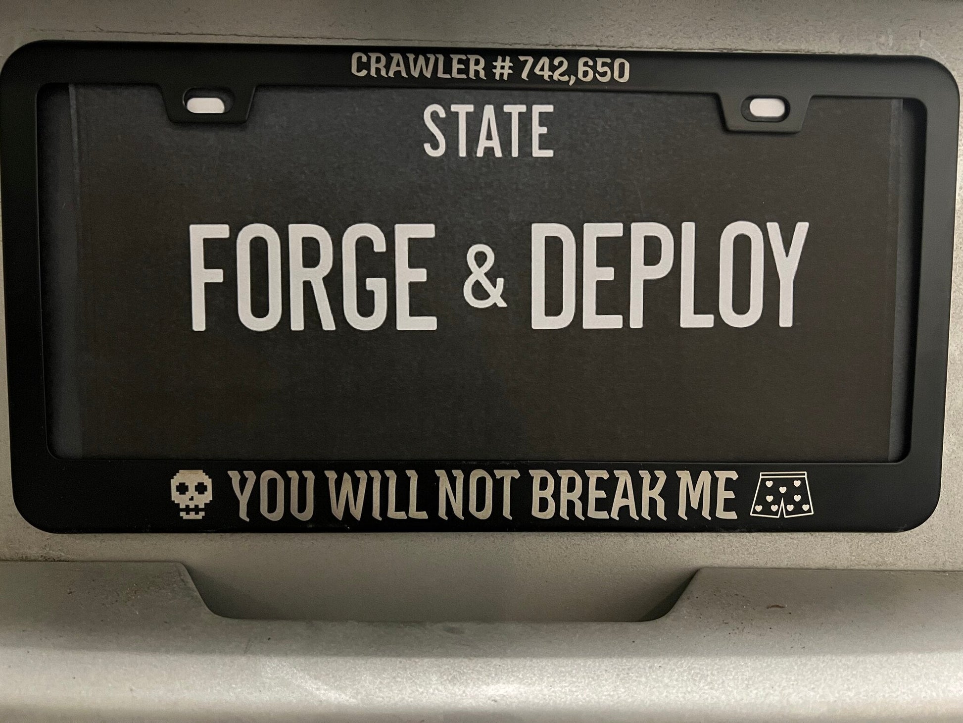 DCC license plate frame mounted on a car - You Will Not Break Me with crawler number