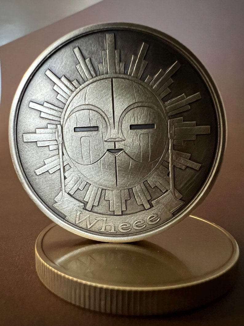 Esquie coin in hand