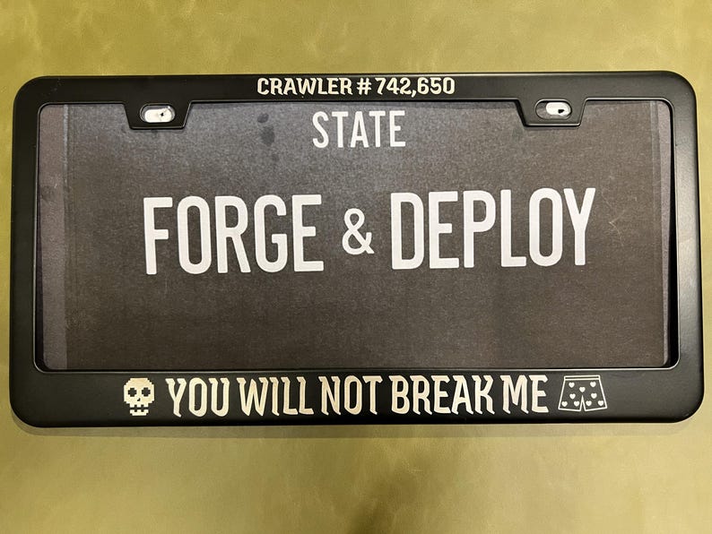 DCC license plate frame - You Will Not Break Me with crawler number