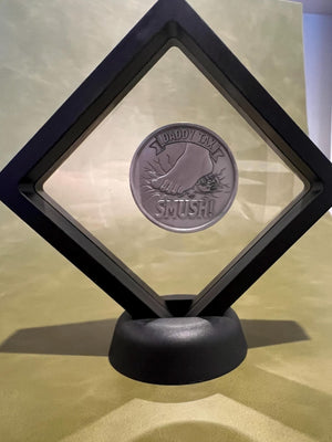 Floating coin display case with Daddy Tax coin