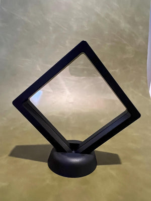 Black floating display case on stand